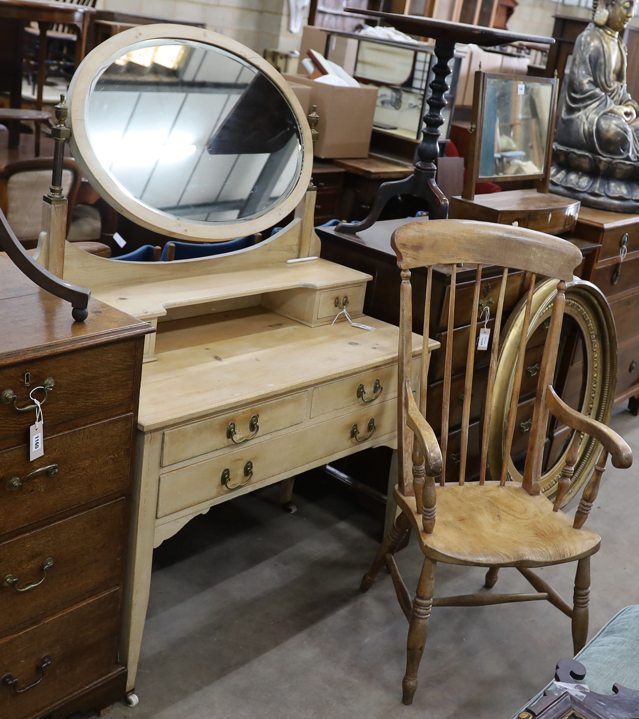 An Edwardian pine dressing table, width 106cm, depth 51cm, height 154cm together with a Victorian elm and beech Windsor armchair